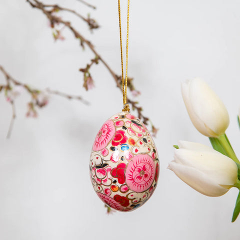 white and pink floral easter egg