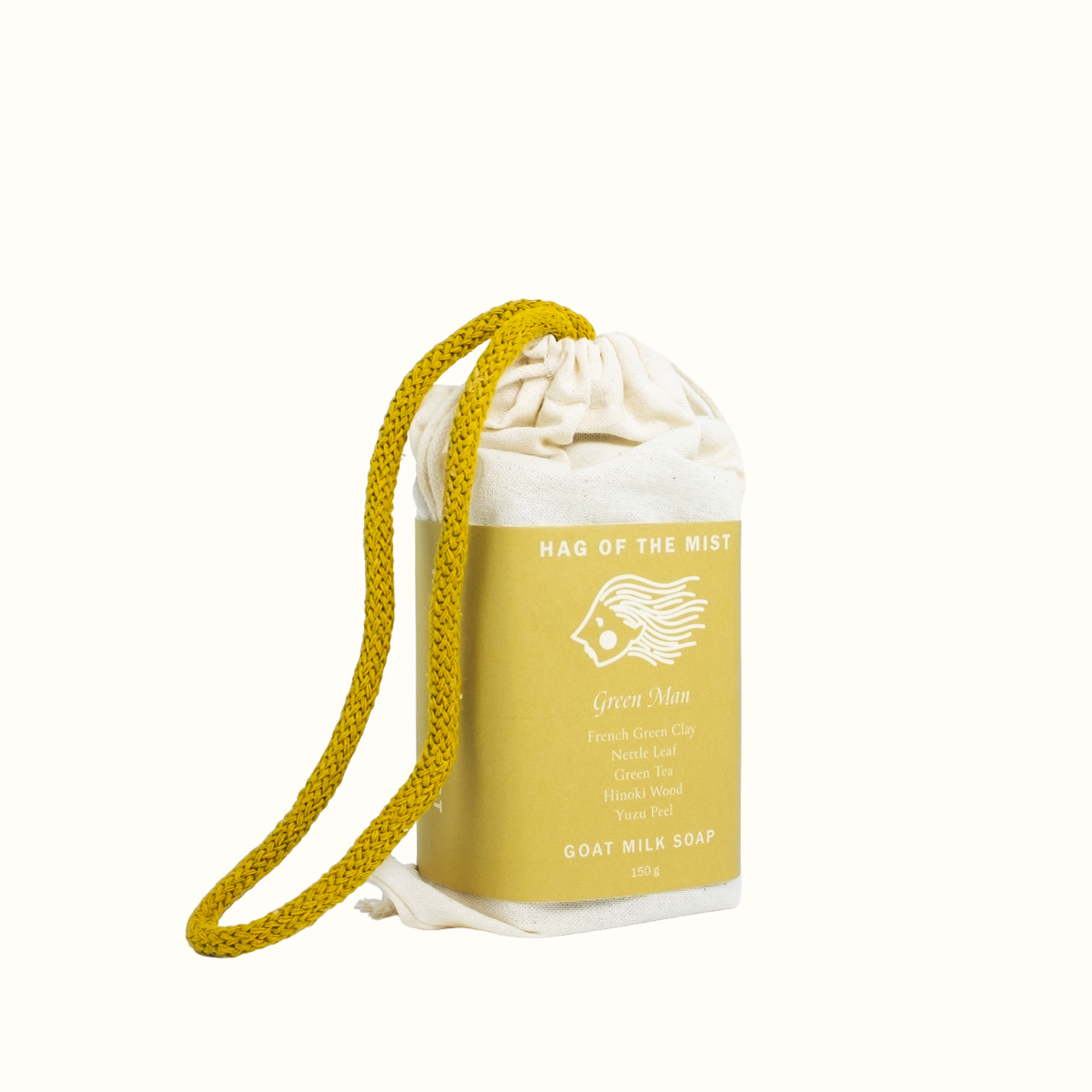 Goat milk soap in a drawstring bag with branding on a white background